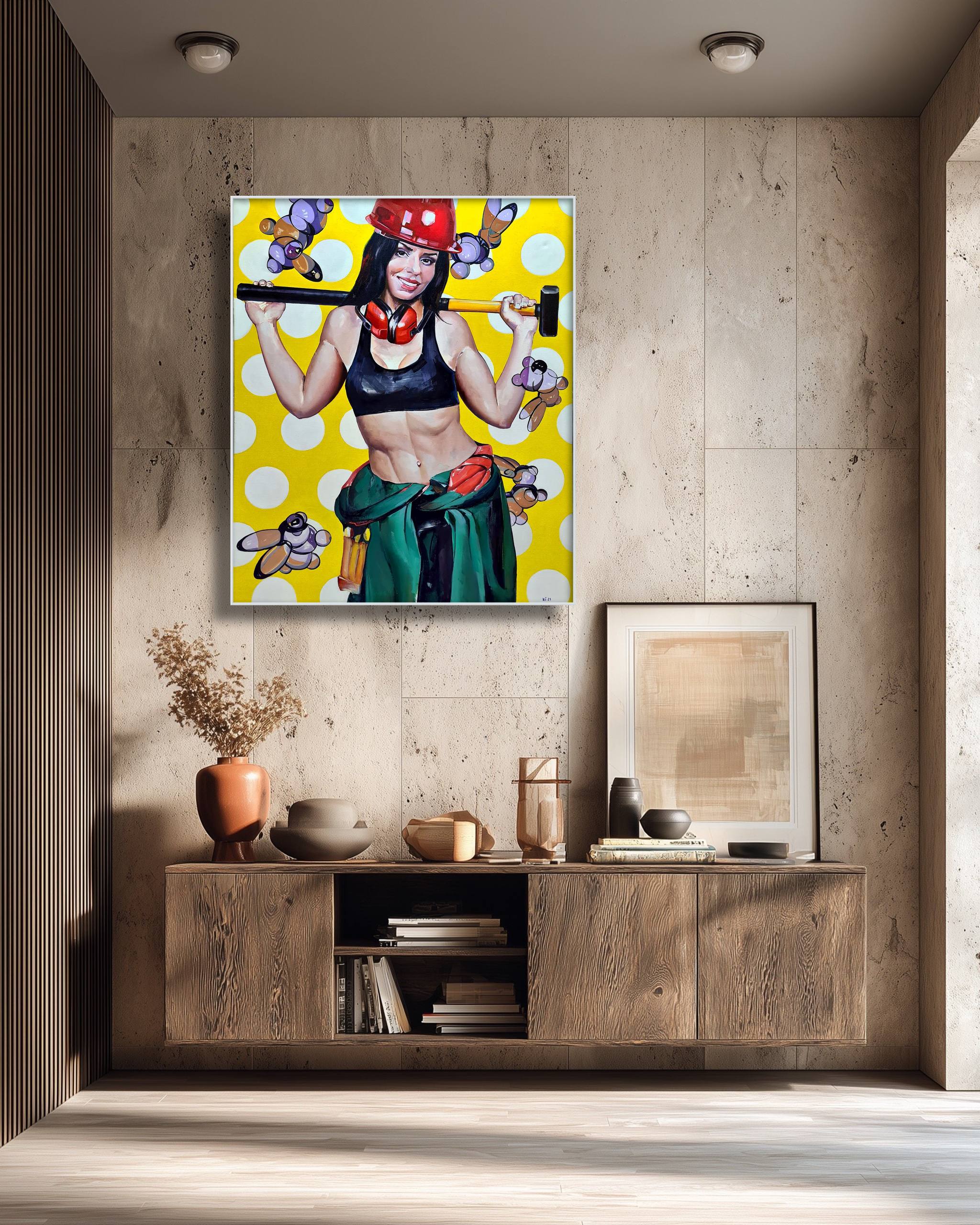 Framed artwork of a woman holding a hammer on a yellow background, displayed in a modern interior setting.