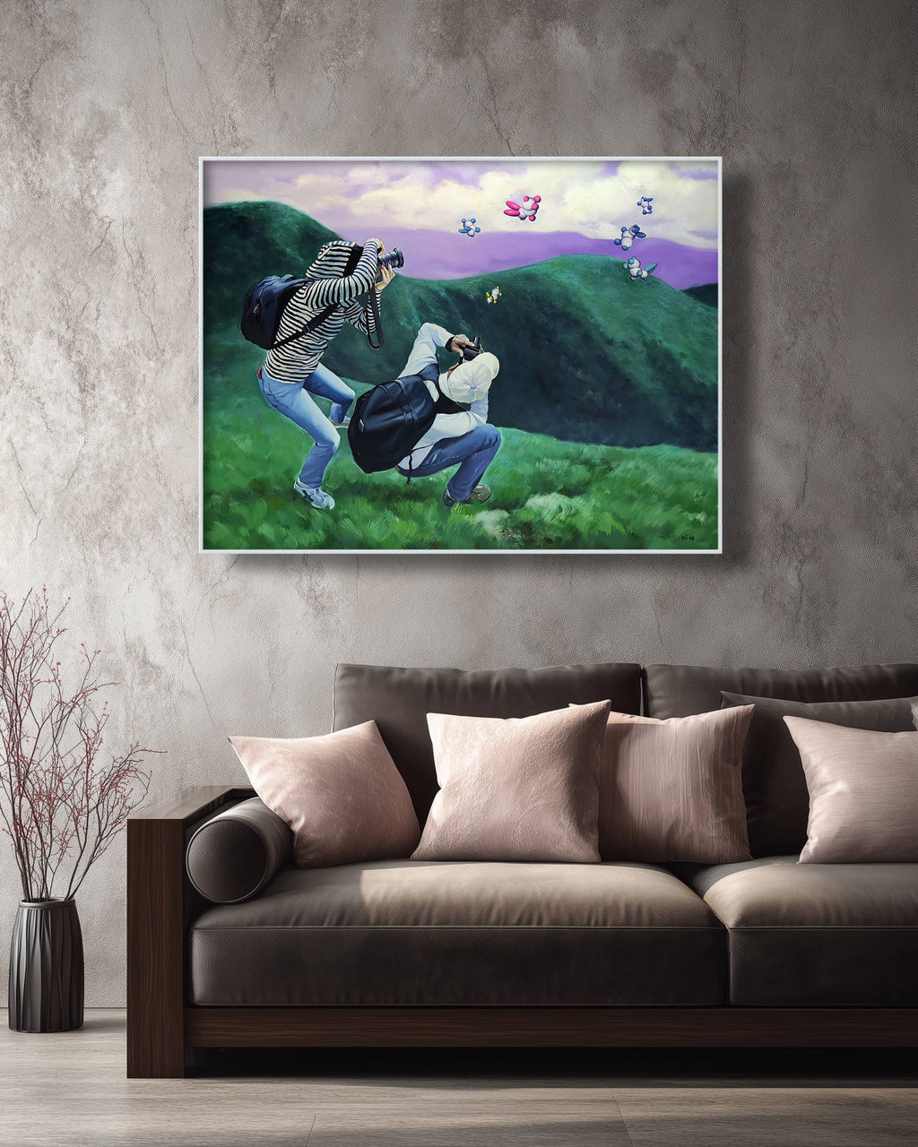 Framed artwork of a golfer on a green hillside with a purple sky, displayed above a brown sofa.