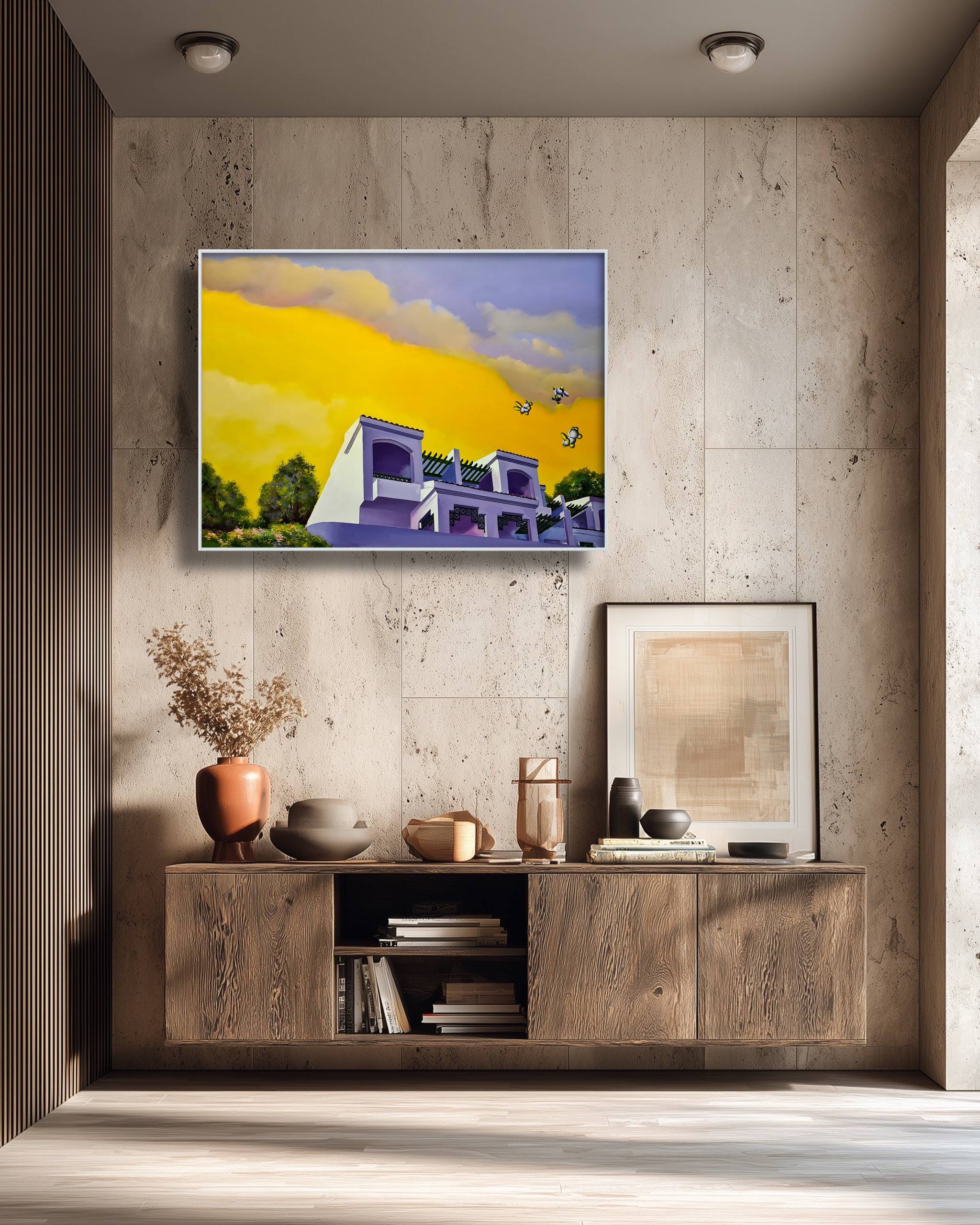 Painting of a modern house on a yellow background hanging above a wooden cabinet.