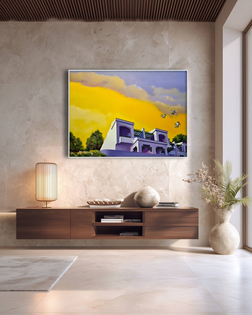 Modern living room with a painting of a house on a yellow sky, a lamp, and decorative items.