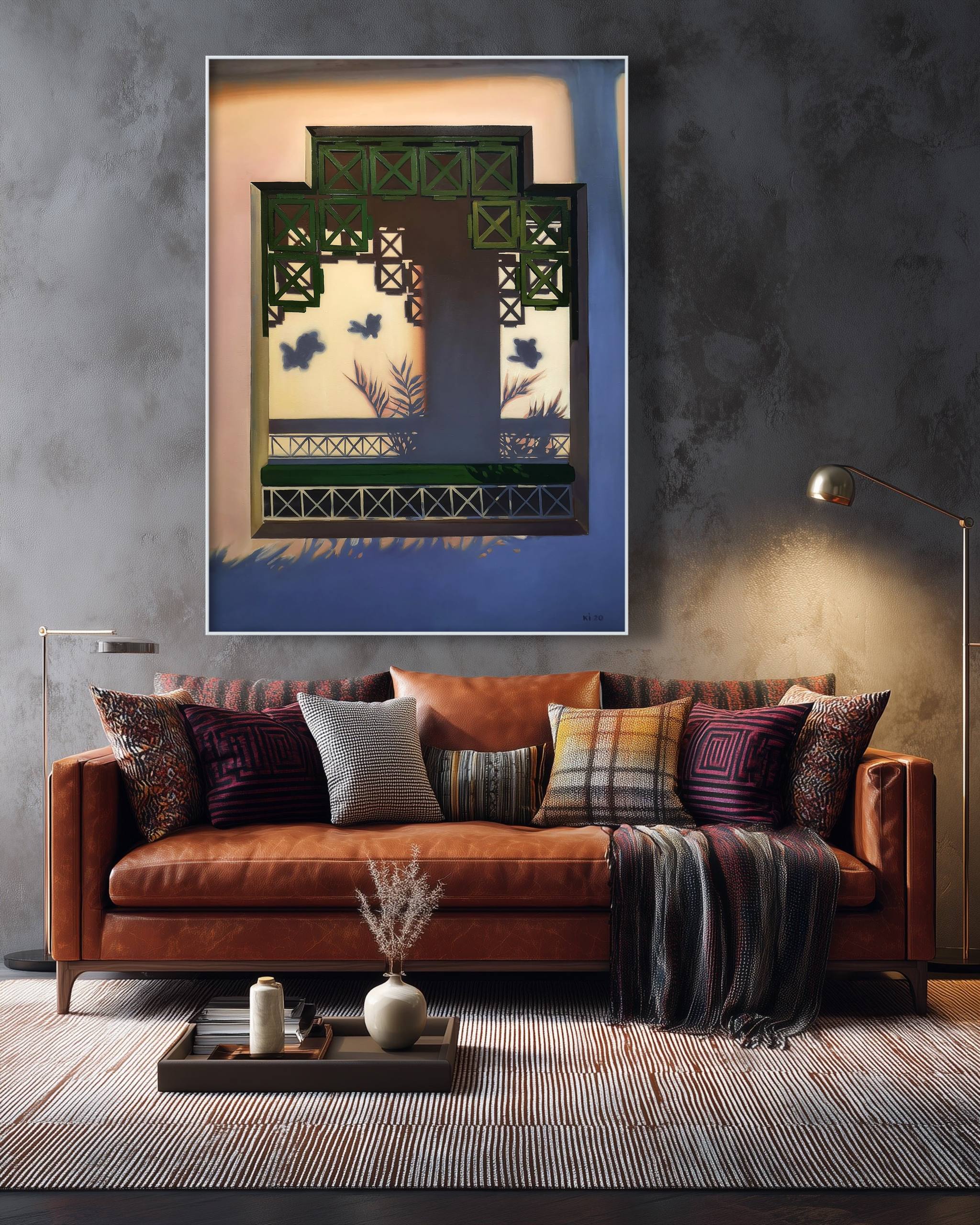Living room with a brown sofa, decorative pillows, and a framed artwork on the wall.