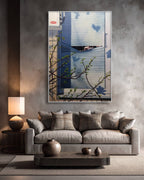 Modern living room with a gray sofa, decorative pillows, and a wall-mounted painting.