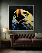 Painting of an eagle head on a wall above a brown sofa in a dimly lit room.