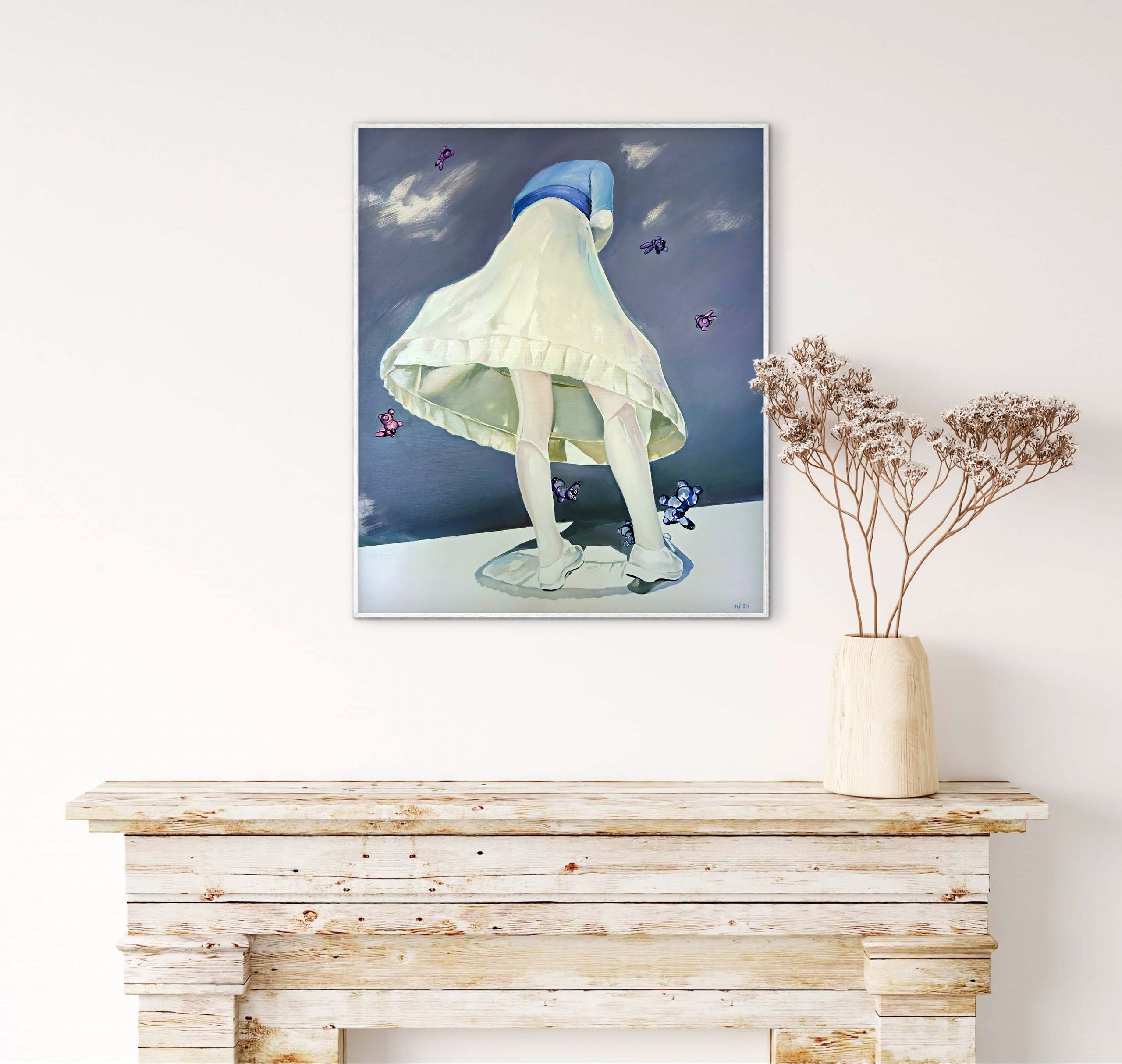 Framed artwork of a person in a hooded garment with butterflies on a white wall above a wooden console table.