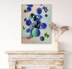 Colorful abstract painting on a wall above a wooden console table with a vase of dried flowers.