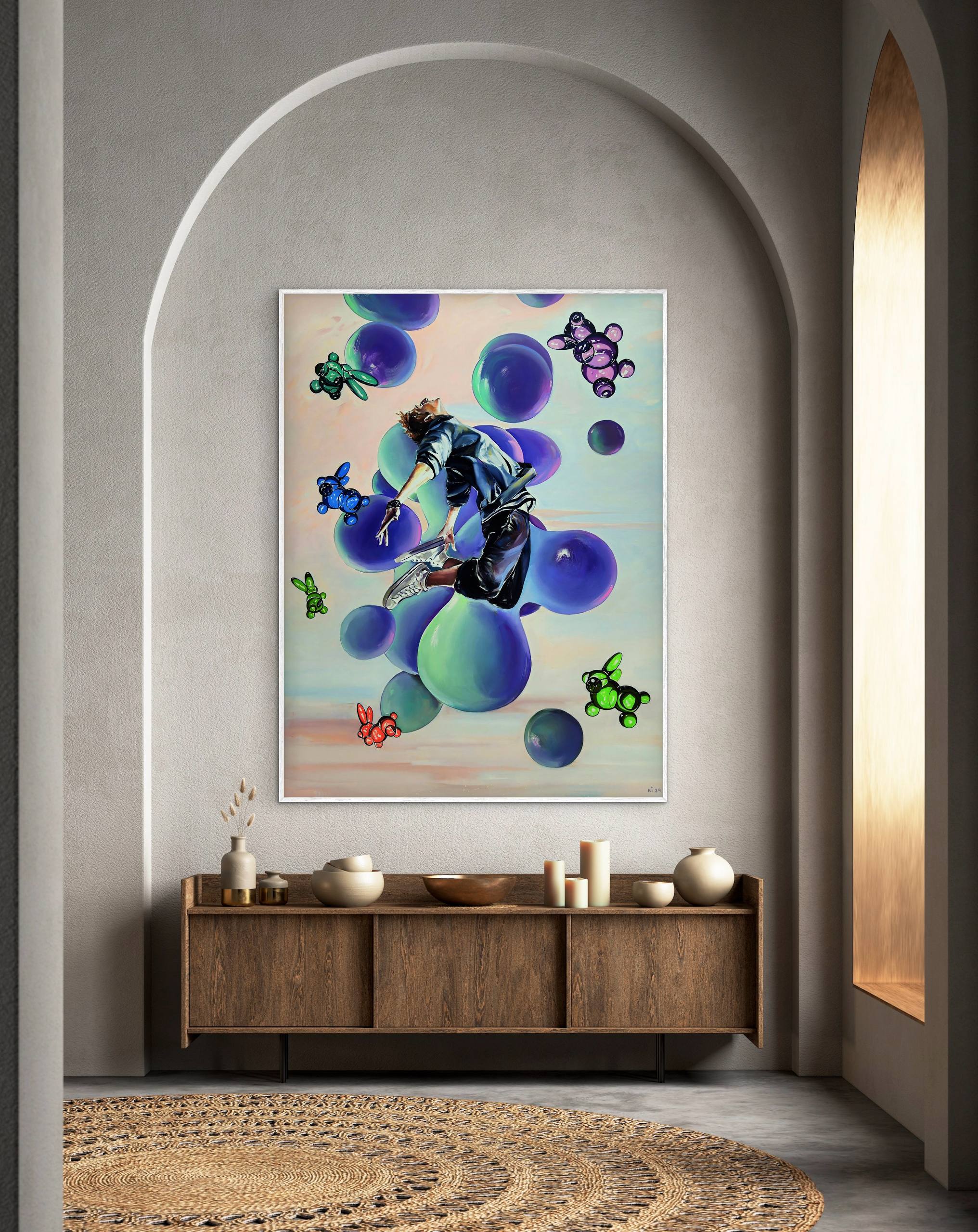 Abstract artwork on a wall above a wooden cabinet with decorative items.