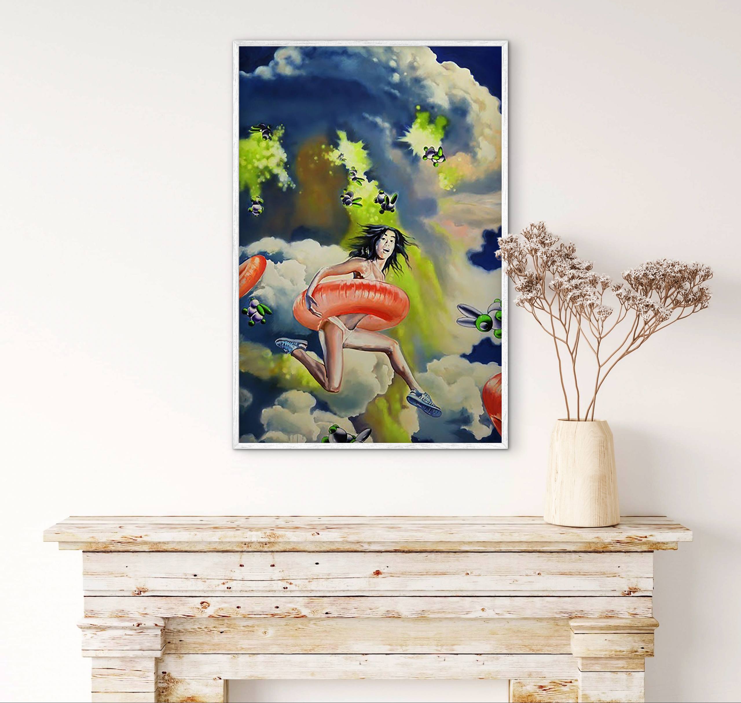Framed artwork of a woman with a red inner tube on a wall above a wooden console table.