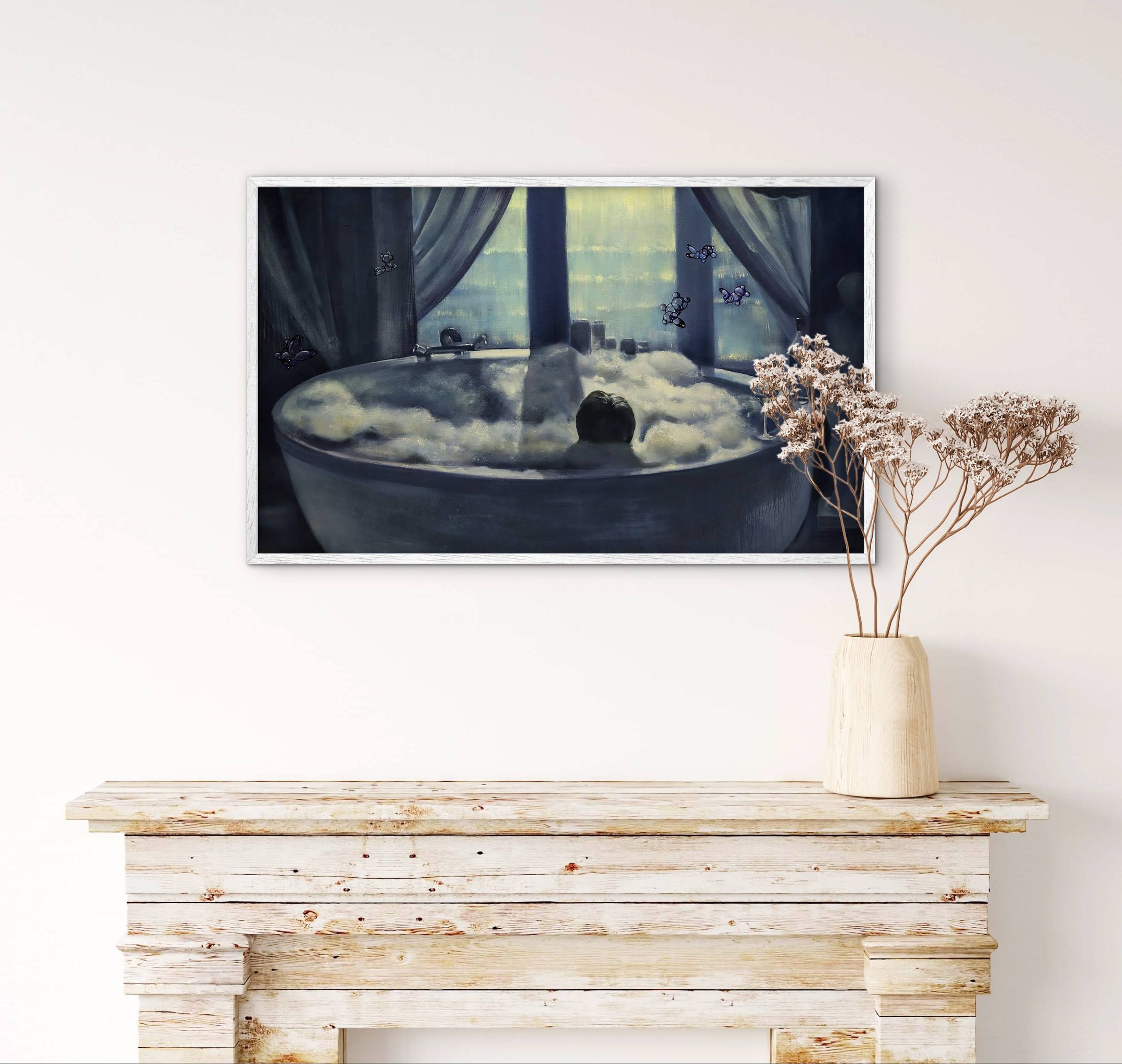 Framed artwork of a person in a bathtub with clouds, placed above a wooden console table.