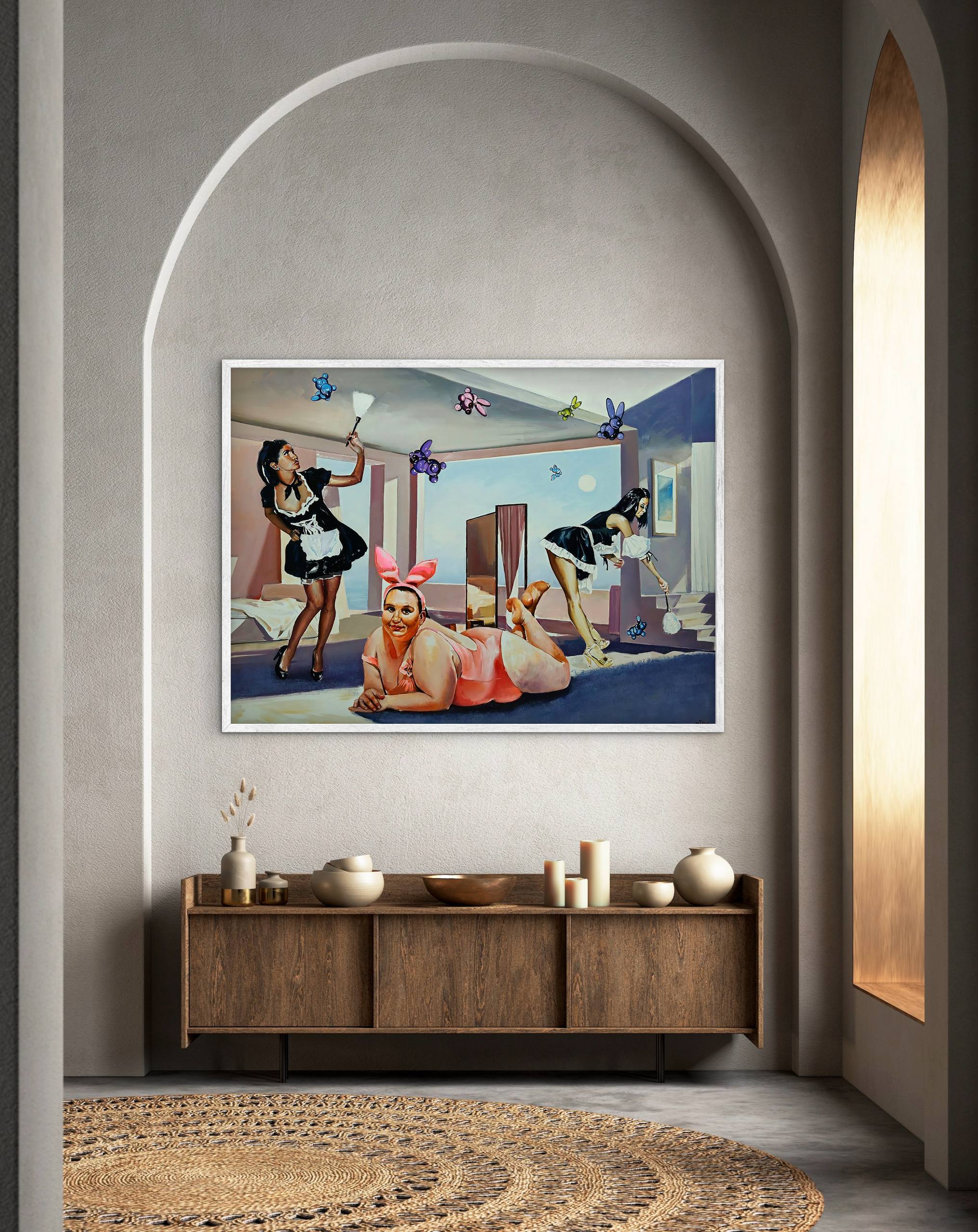 Framed artwork on a wall above a wooden cabinet with decorative items.