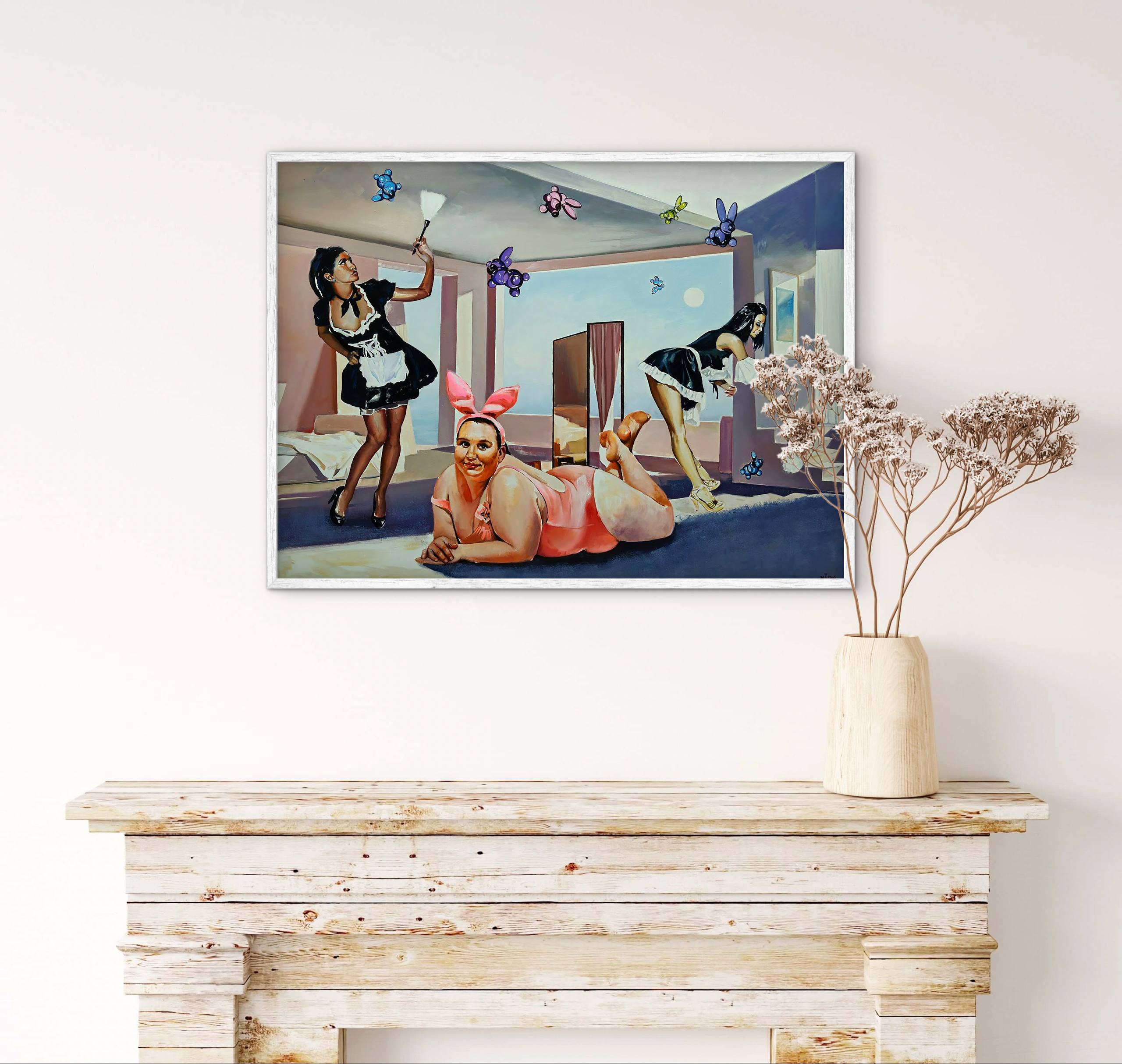 Framed artwork of a woman in a maid outfit and another in lingerie on a white wall above a wooden console table.