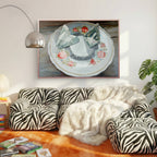 Living room with zebra-patterned sofa, white fur throw, and framed artwork on the wall.