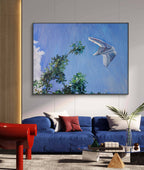 Modern living room with a blue sofa, red chair, and a painting of a white airplane flying over green trees.