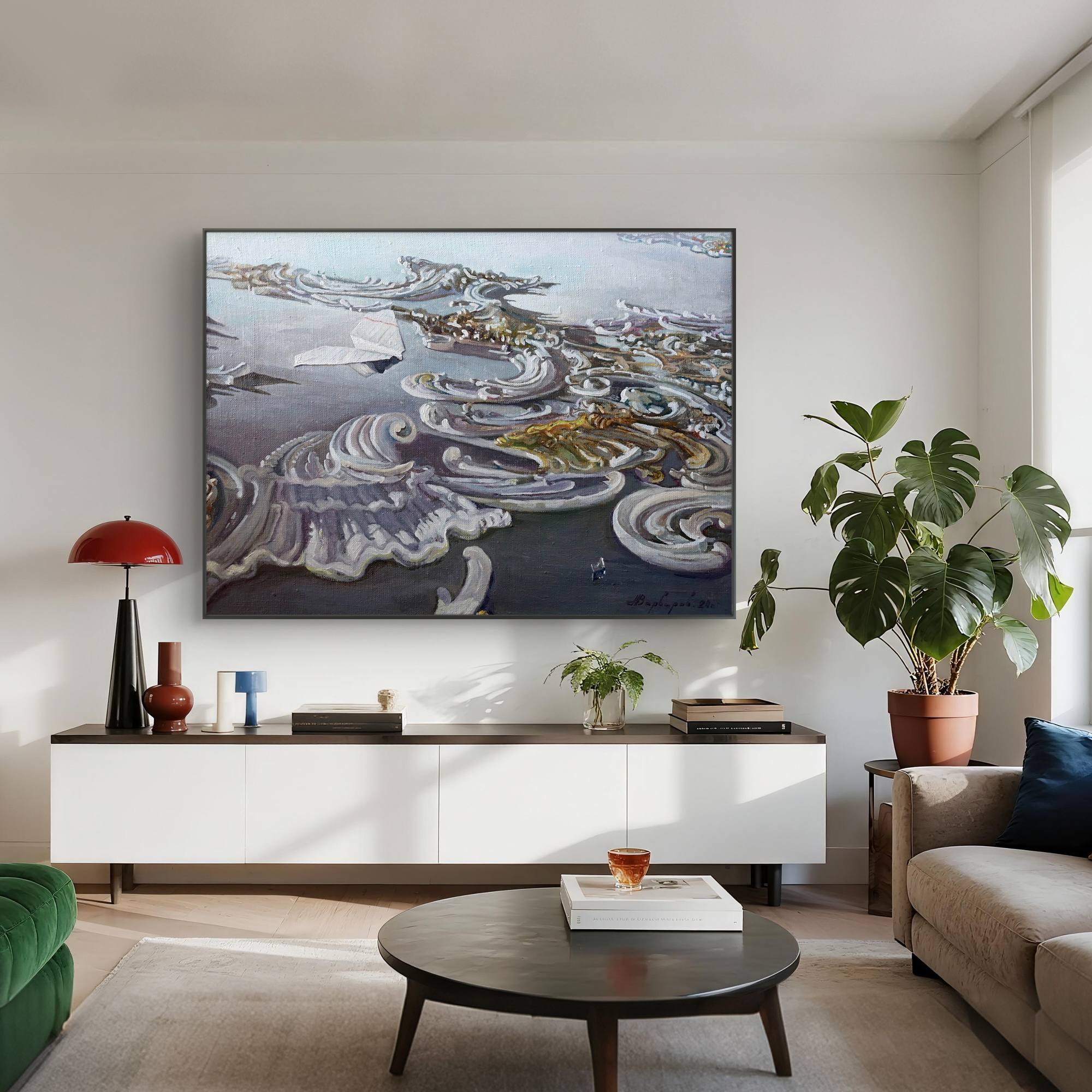 Modern living room with a large abstract painting on the wall, a white console table, and a green armchair.