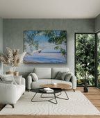 Modern living room with a gray sofa, coffee table, and decorative painting of dolphins.