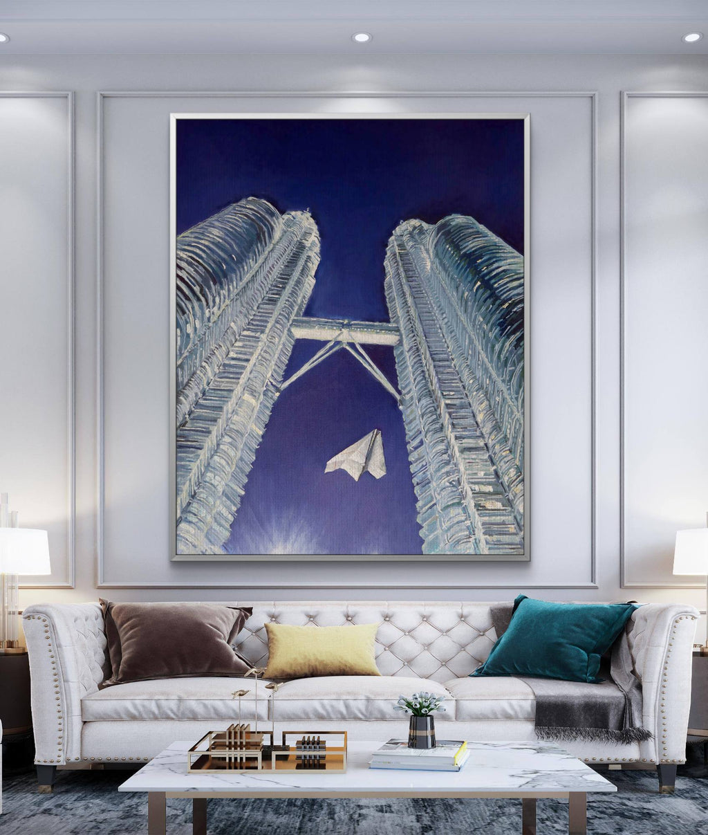 Modern living room with a large framed artwork of architectural design on the wall.