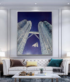 Modern living room with a large framed artwork of architectural design on the wall.