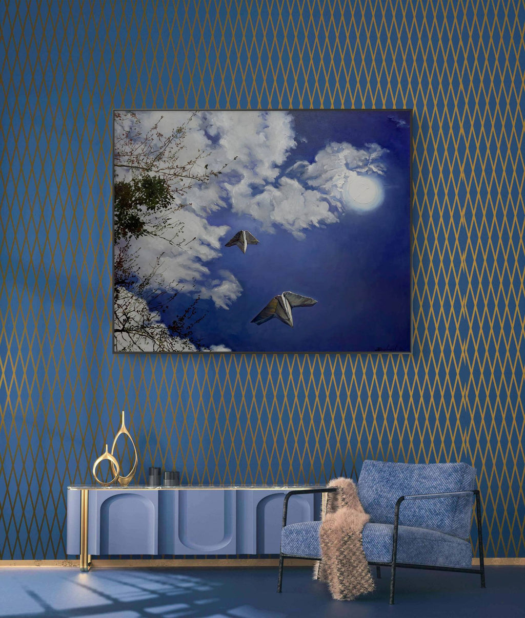 Modern living room with blue walls, a blue sofa, and a decorative painting of a butterfly and moon.
