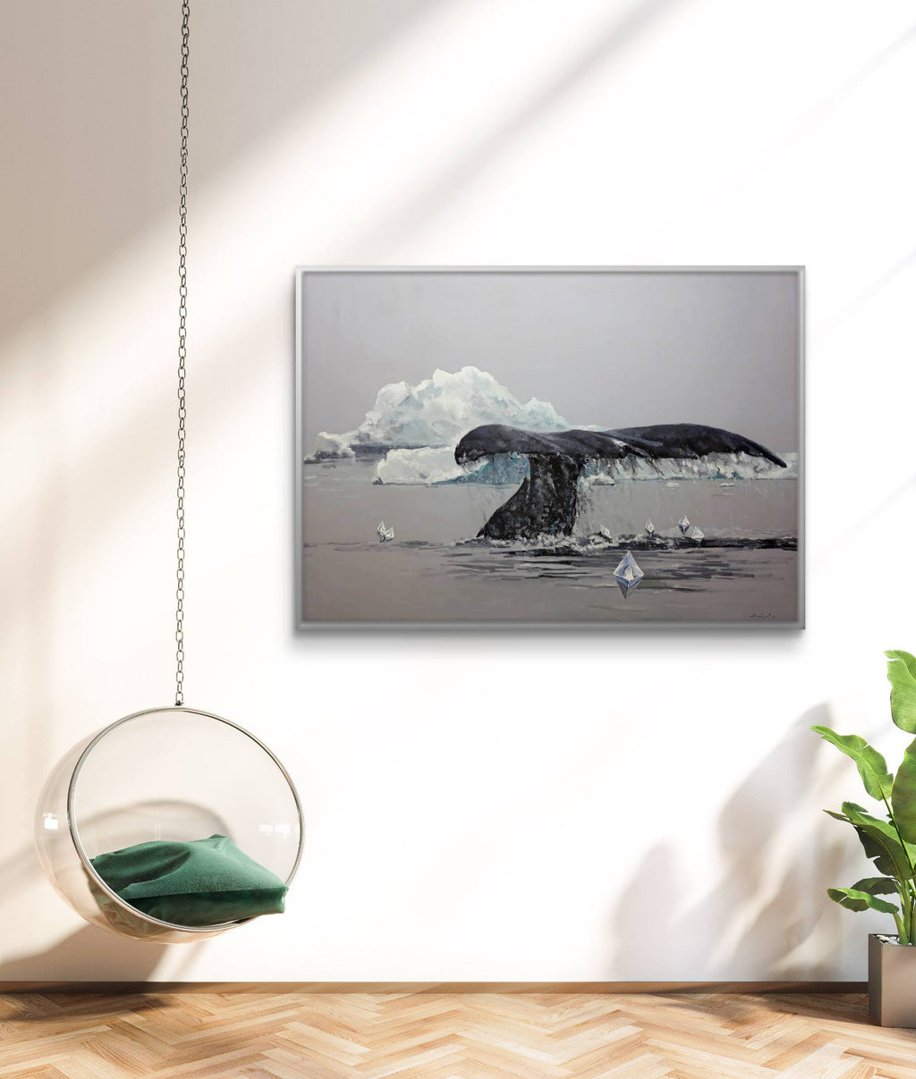 Framed artwork of a whale tail in an interior setting with a chair and plant.