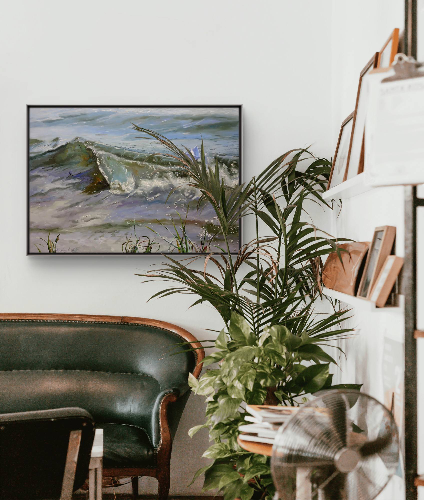 Living room with a painting of a landscape, green sofa, and plants.
