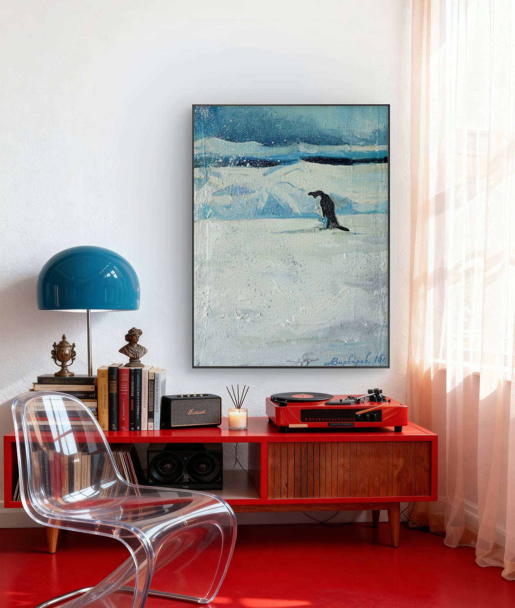 Modern interior with red console table, blue lamp, and abstract painting.