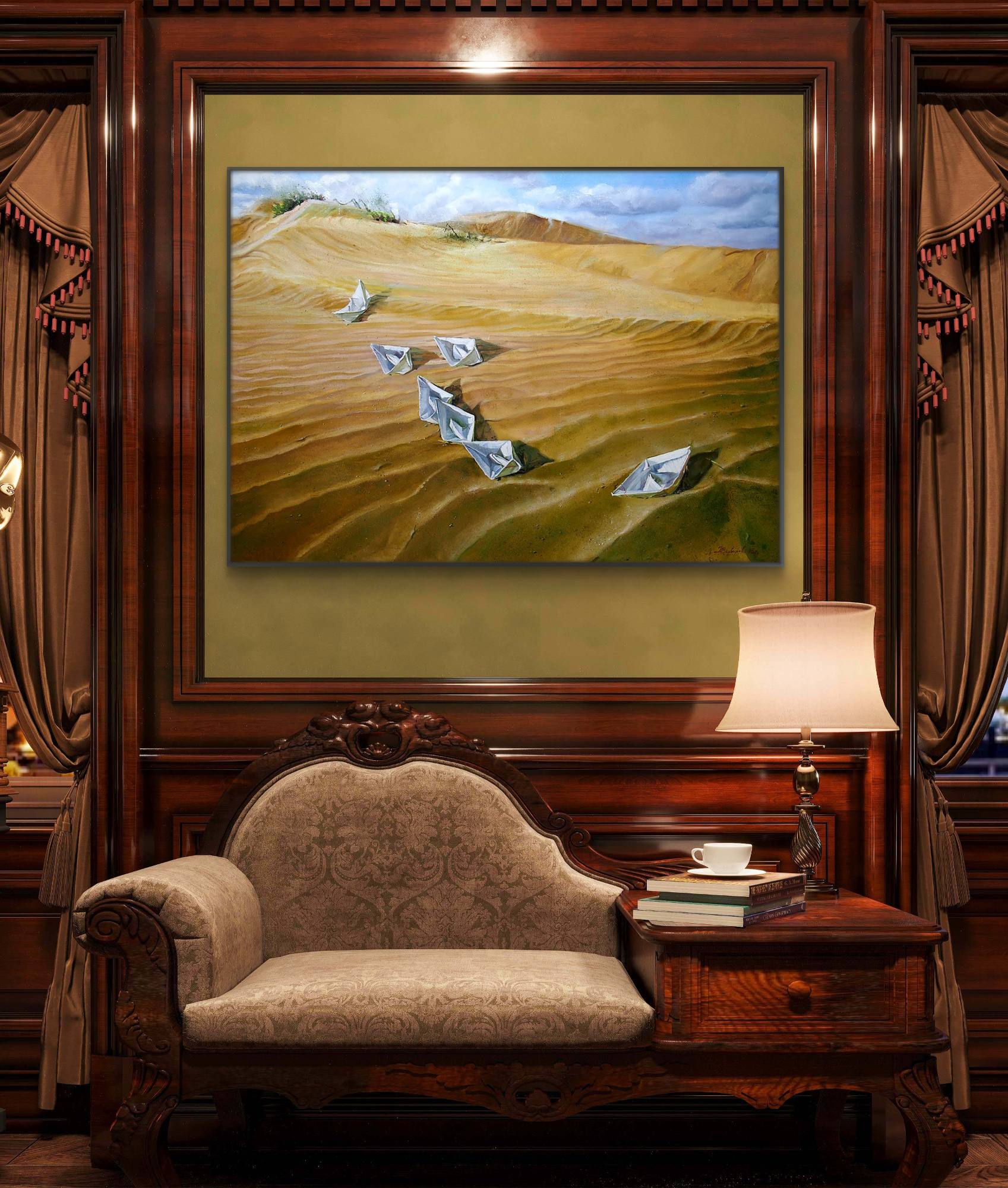 Framed painting of a desert landscape with birds on a wall above a sofa.