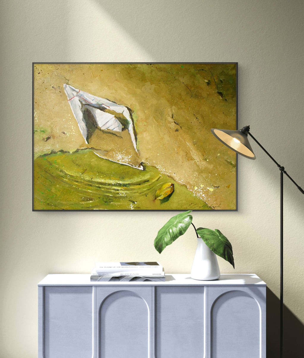 Framed abstract painting on a wall above a white cabinet with decorative items.