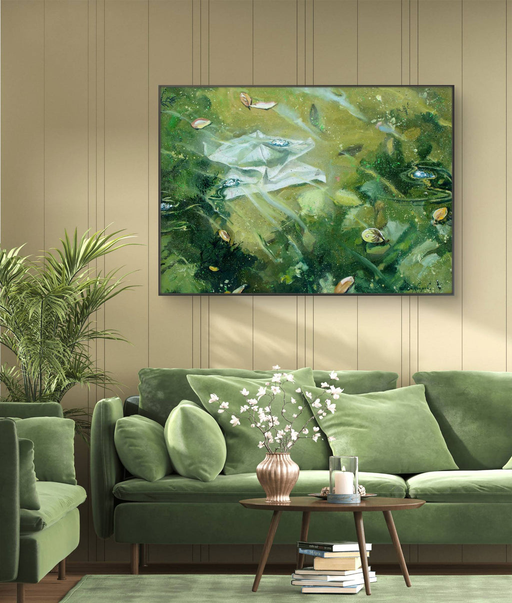 Green living room with a painting of a natural scene on the wall.