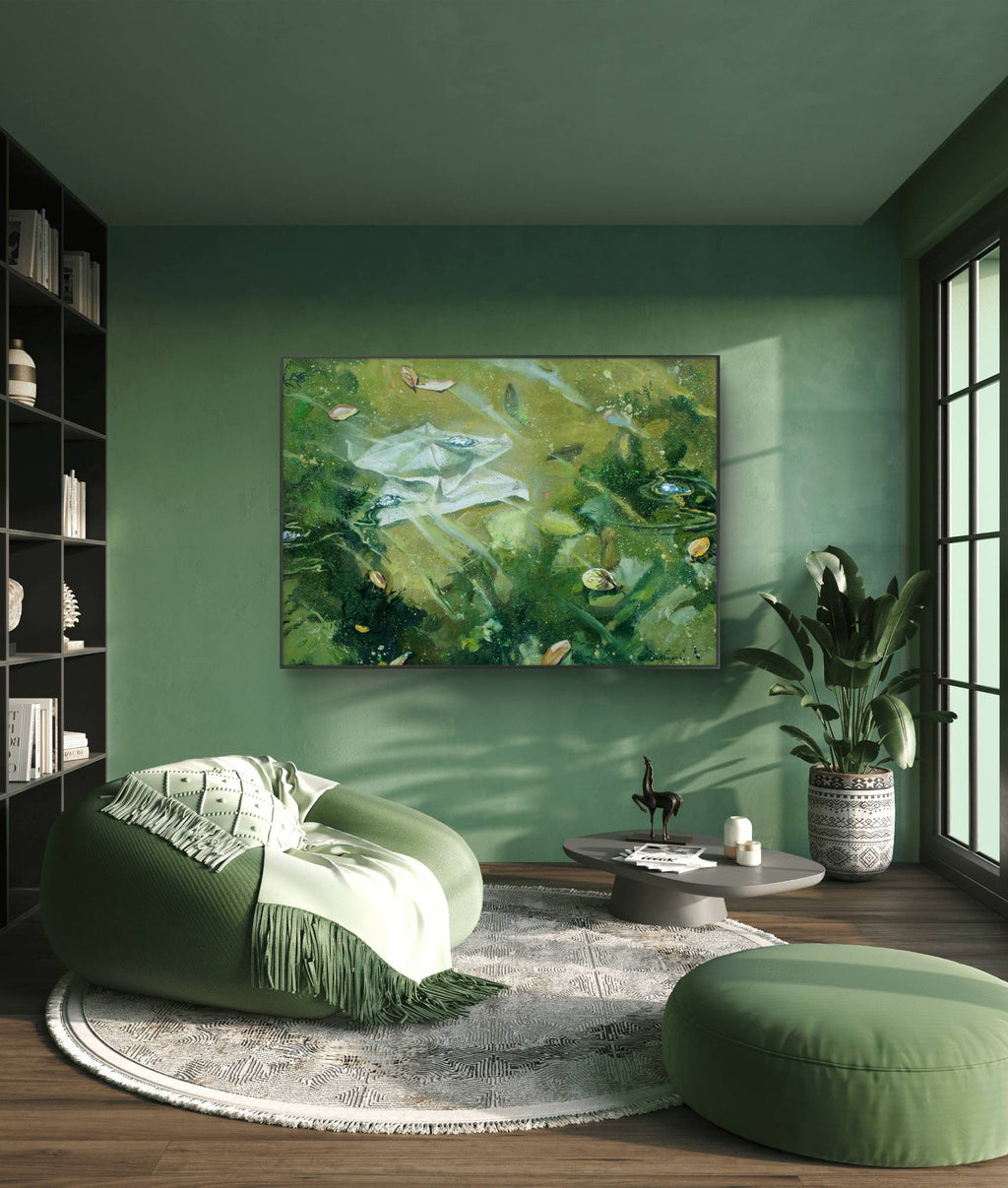 Modern living room with green walls, a green ottoman, and a painting of a natural scene.