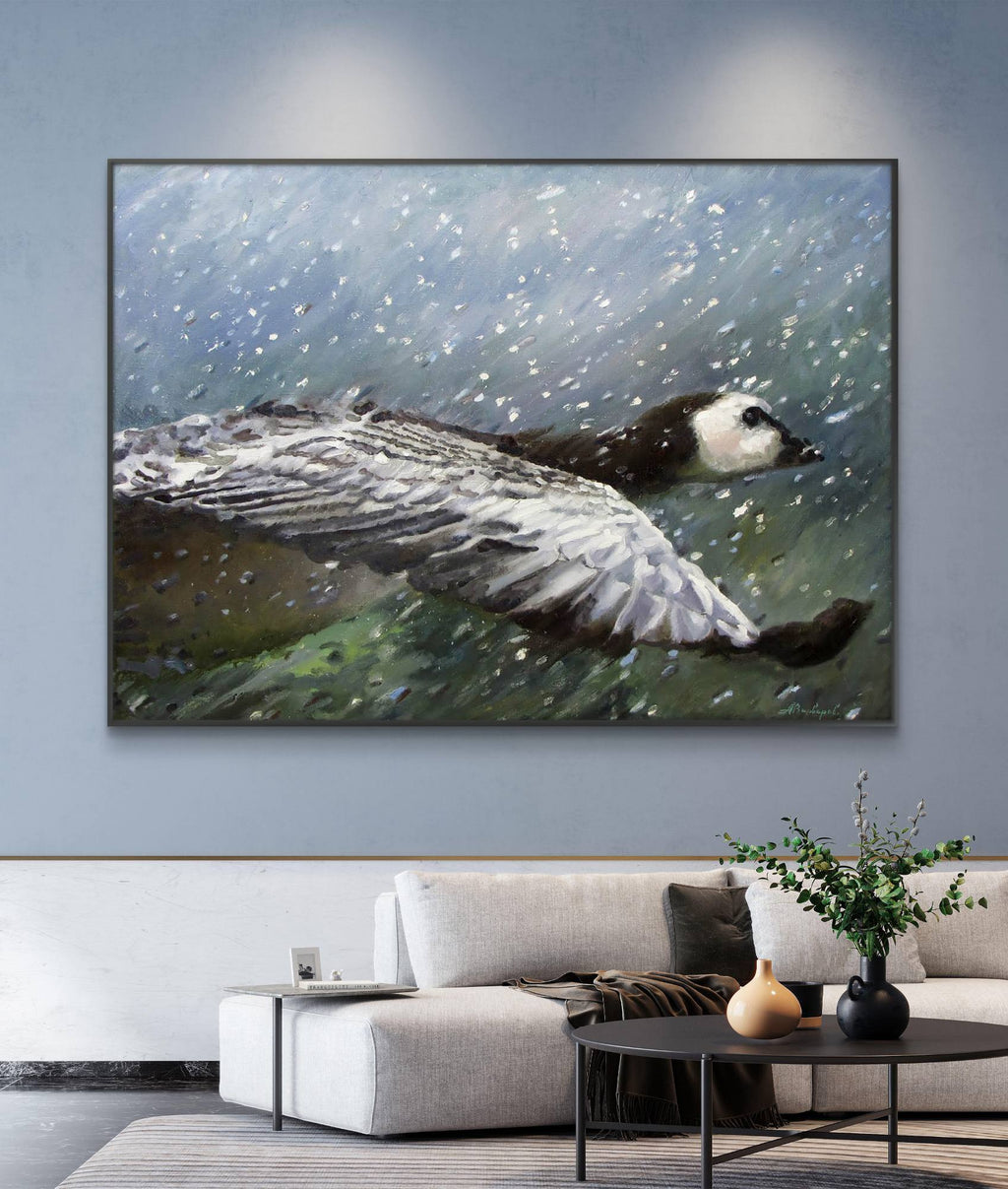 Framed painting of a duck in water on a wall in a living room.