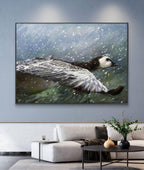 Framed painting of a duck in water on a wall in a living room.
