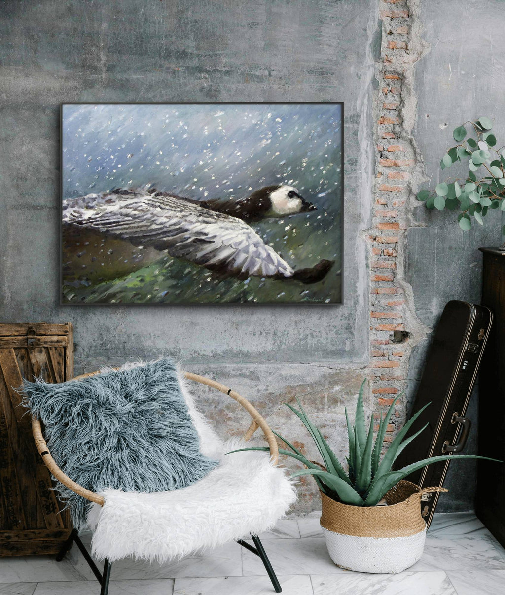 Room interior with a painting of a duck, chair with fur cover, and guitar against a brick wall.