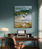 Home office with a desk, chair, and laptop, featuring a large wall art of paper boats on water.