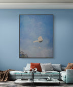 Living room with a large abstract painting on a blue wall, a sectional sofa with colorful pillows, and a coffee table.