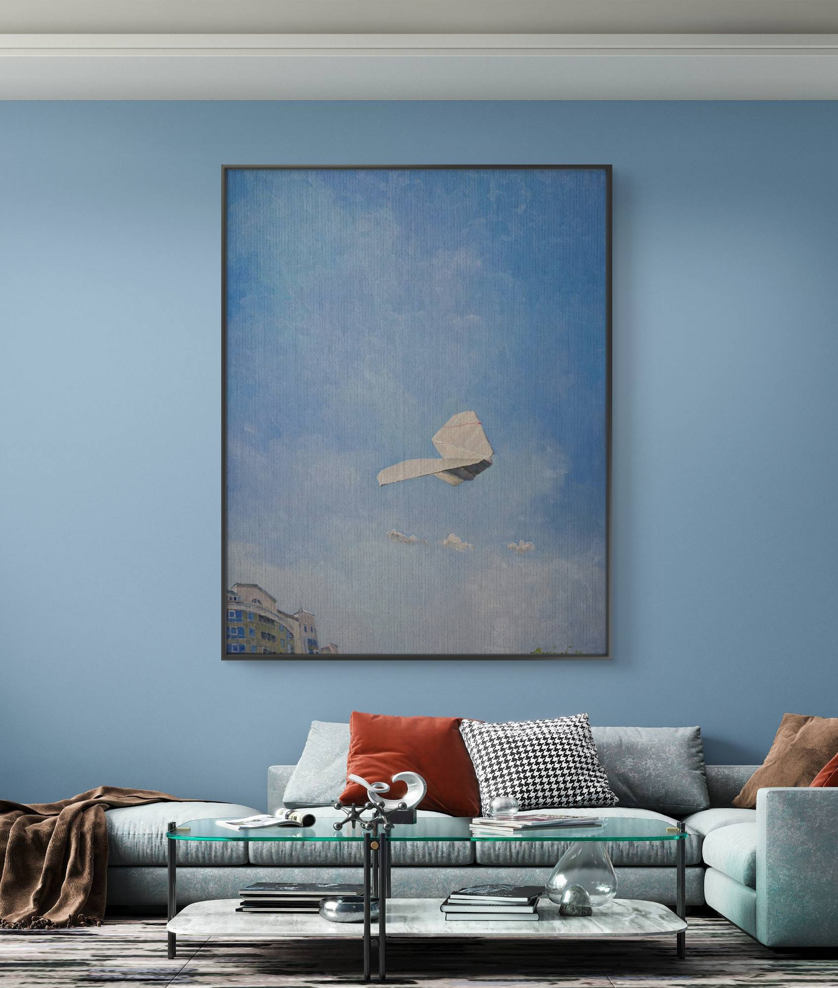 Living room with a large abstract painting on a blue wall, a sectional sofa with colorful pillows, and a coffee table.