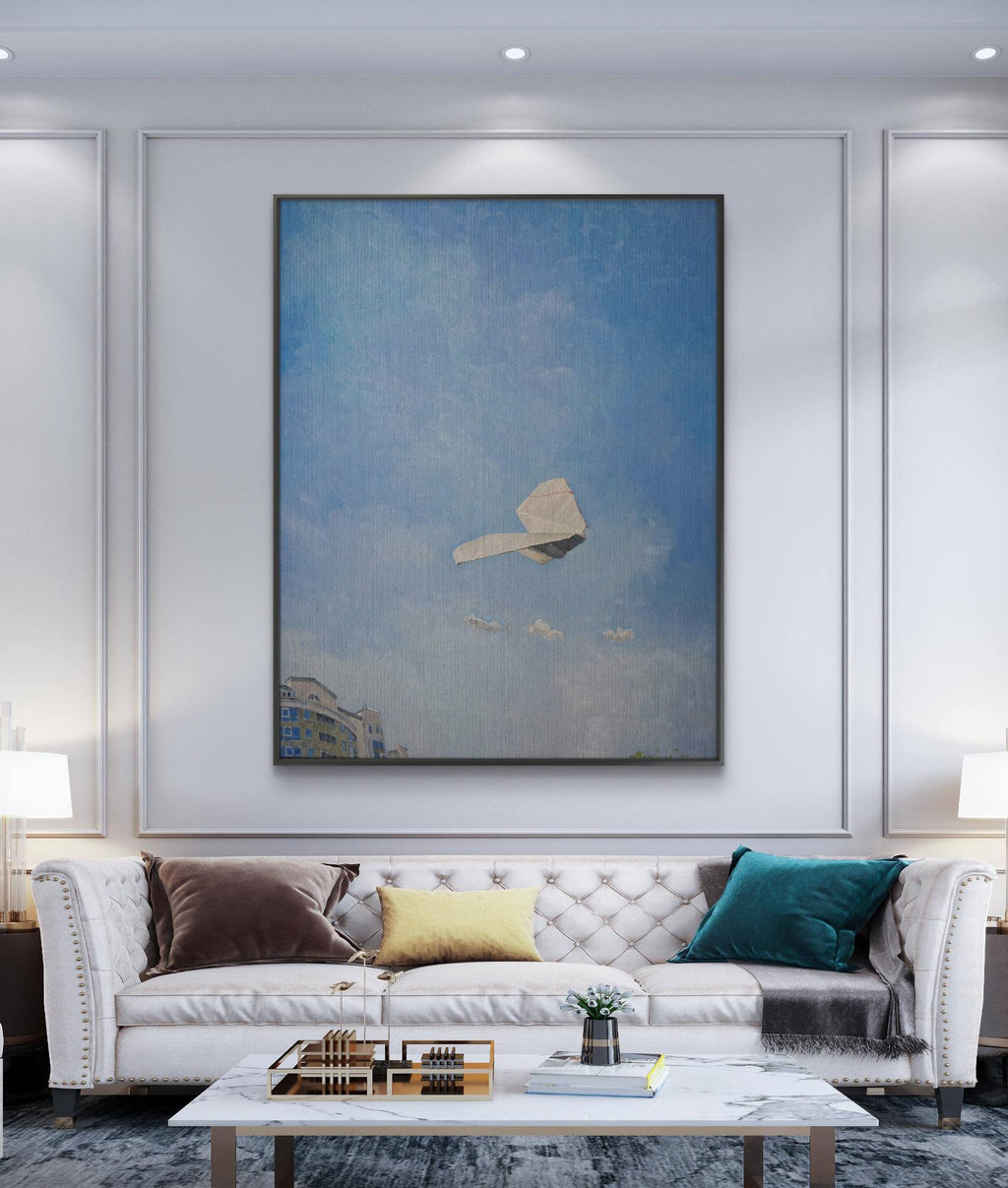Modern living room with a white sofa, coffee table, and large abstract painting on the wall.