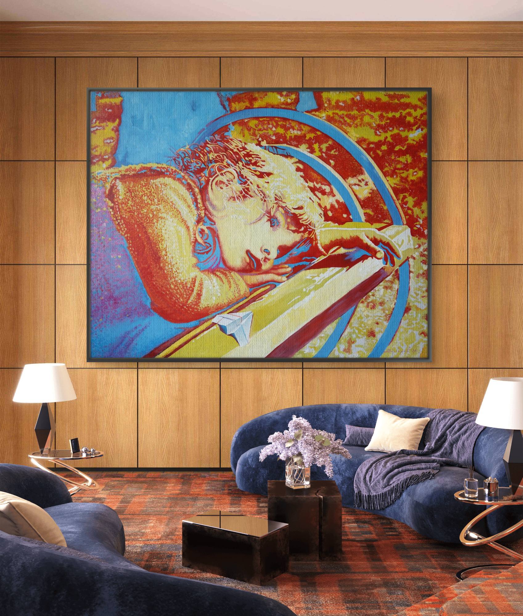 Colorful abstract painting of a woman on a wooden wall above a blue sofa in a living room.