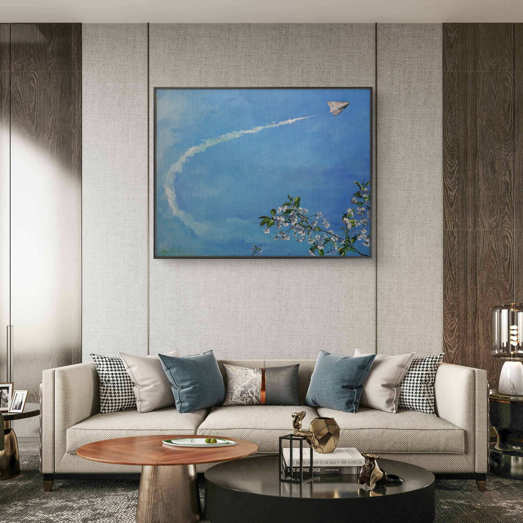 Modern living room with a sofa, coffee table, and wall art.
