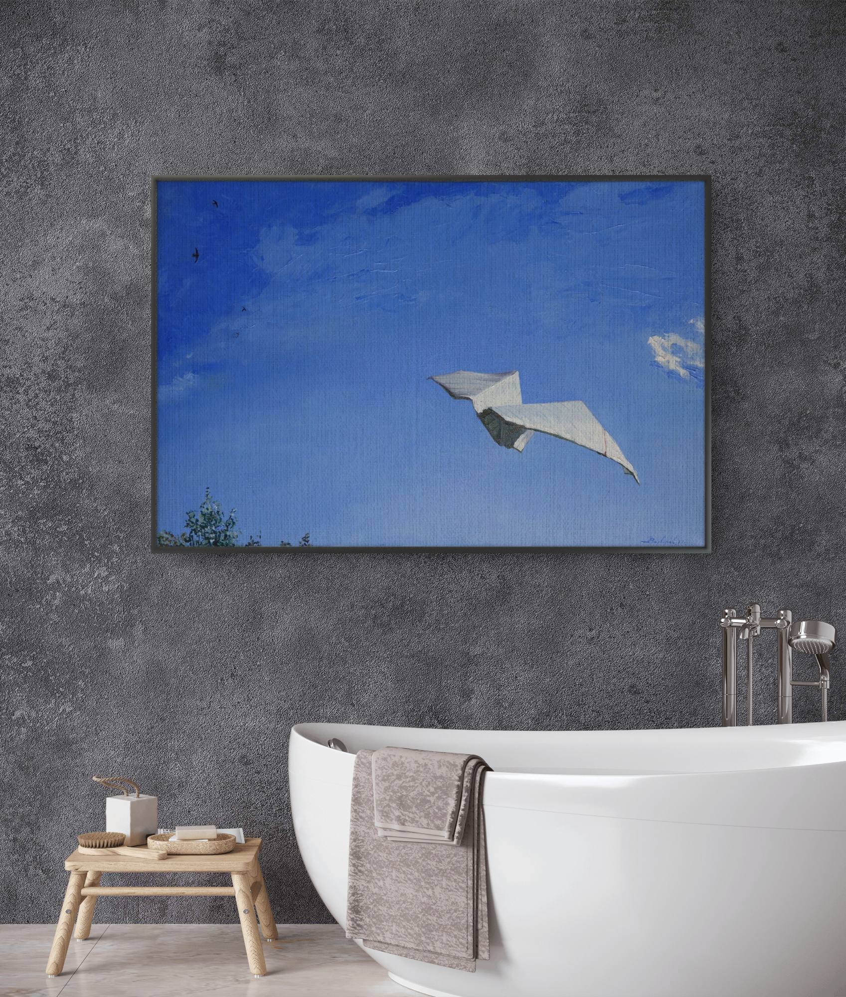 Bathroom with a large framed artwork of a bird flying against a blue sky.