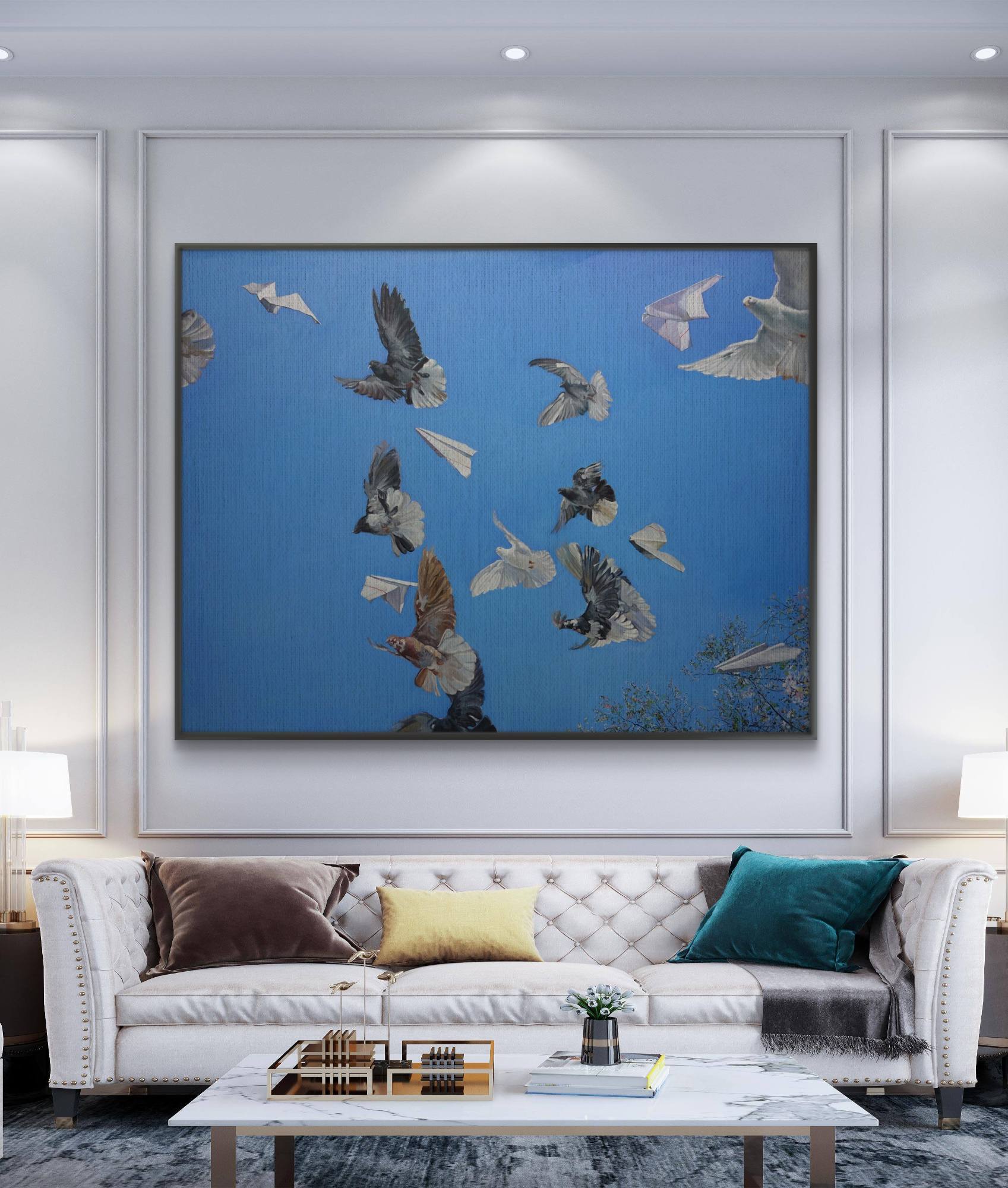 Modern living room with a white sofa, coffee table, and large framed artwork of birds on a blue background.