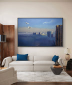 Living room with a large wall-mounted painting of a cityscape.