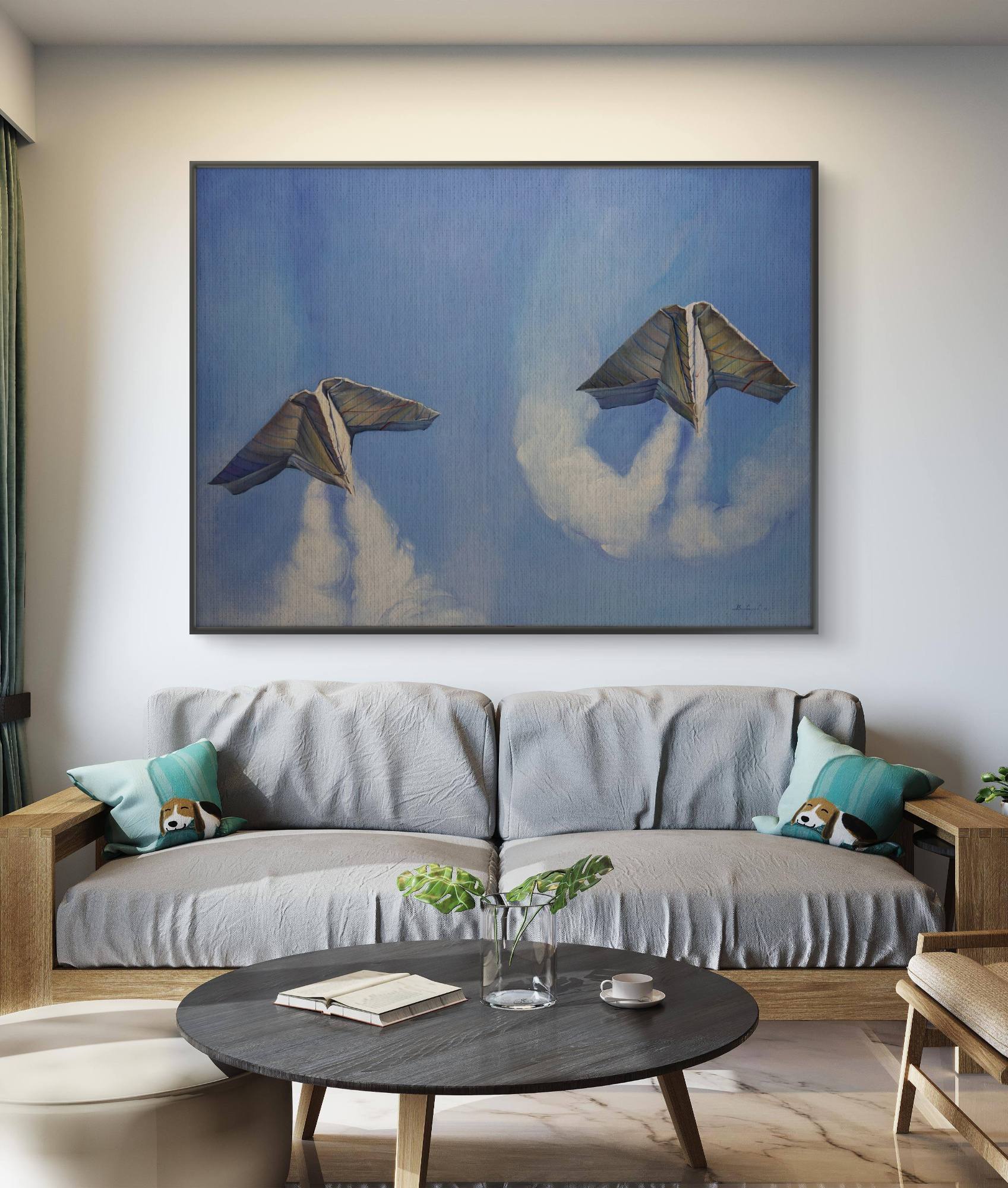 Living room with a gray sofa, round wooden coffee table, and a large abstract painting on the wall.
