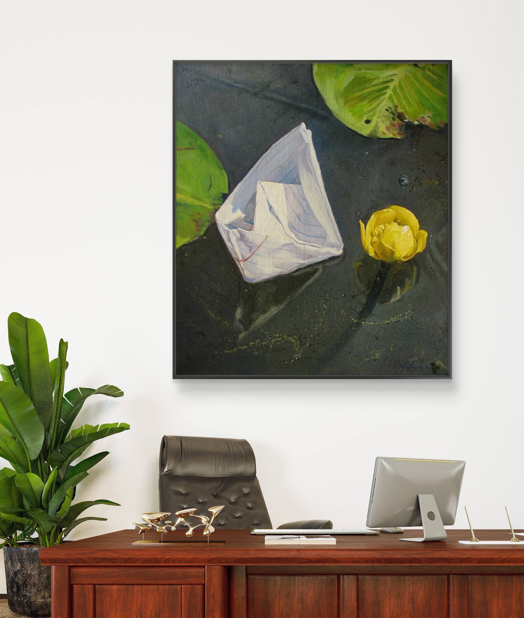 Framed artwork of a still life with flowers on a wall above a desk.