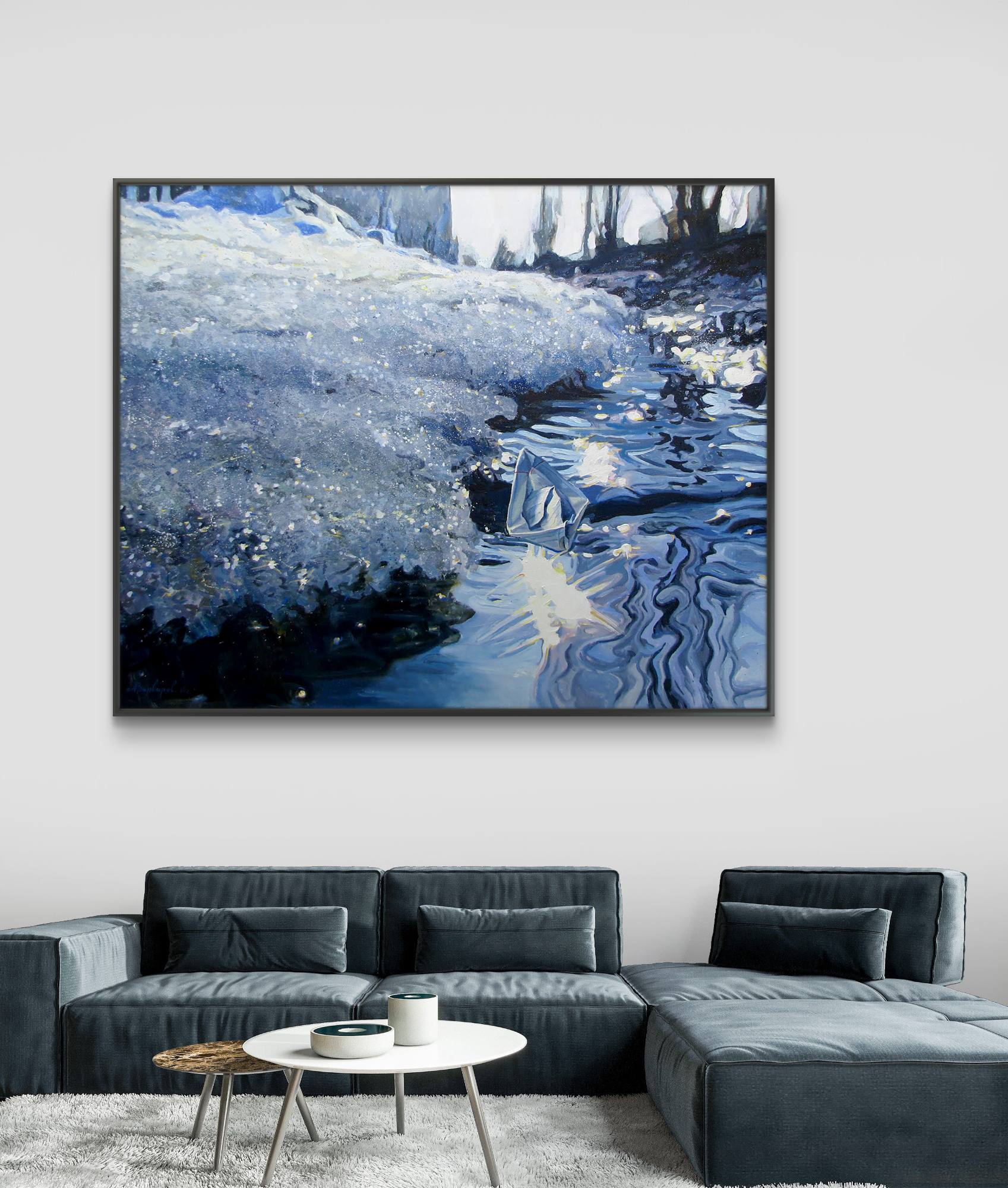 Framed artwork of a snowy landscape above a gray sectional sofa in a living room.
