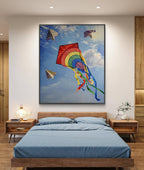 Bedroom with a large painting of kites on the wall above a bed.