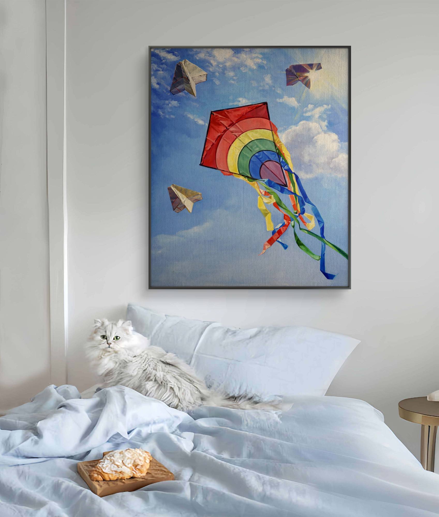 Bedroom with a colorful kite painting above the bed