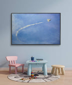 Children's playroom with a large framed artwork of a kite flying in the sky.