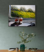 Framed painting of two glasses on a train window with a scenic view.