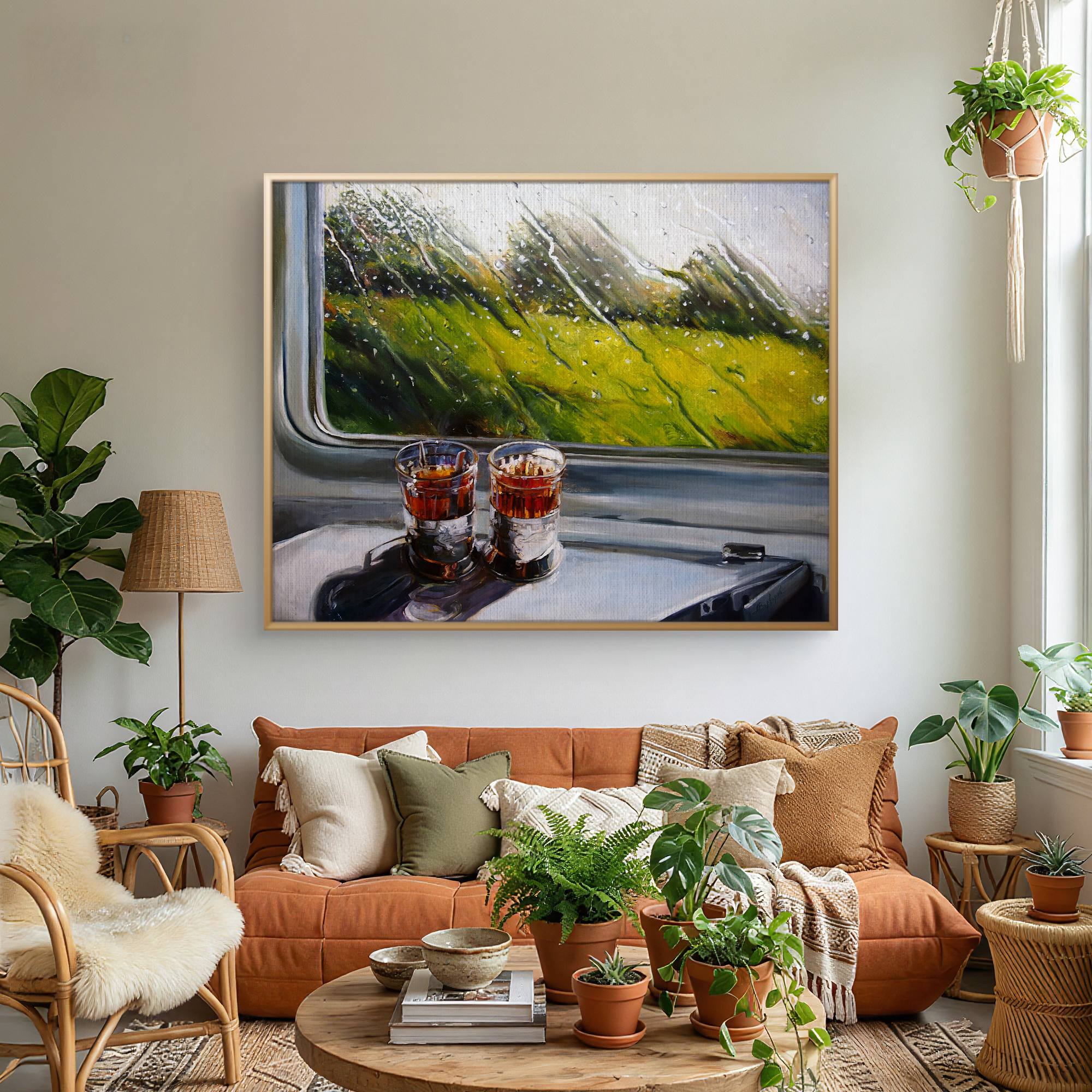 Living room with orange sofa, decorative plants, and a framed painting of a train interior.