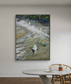 Framed abstract painting on a wall above a dining table