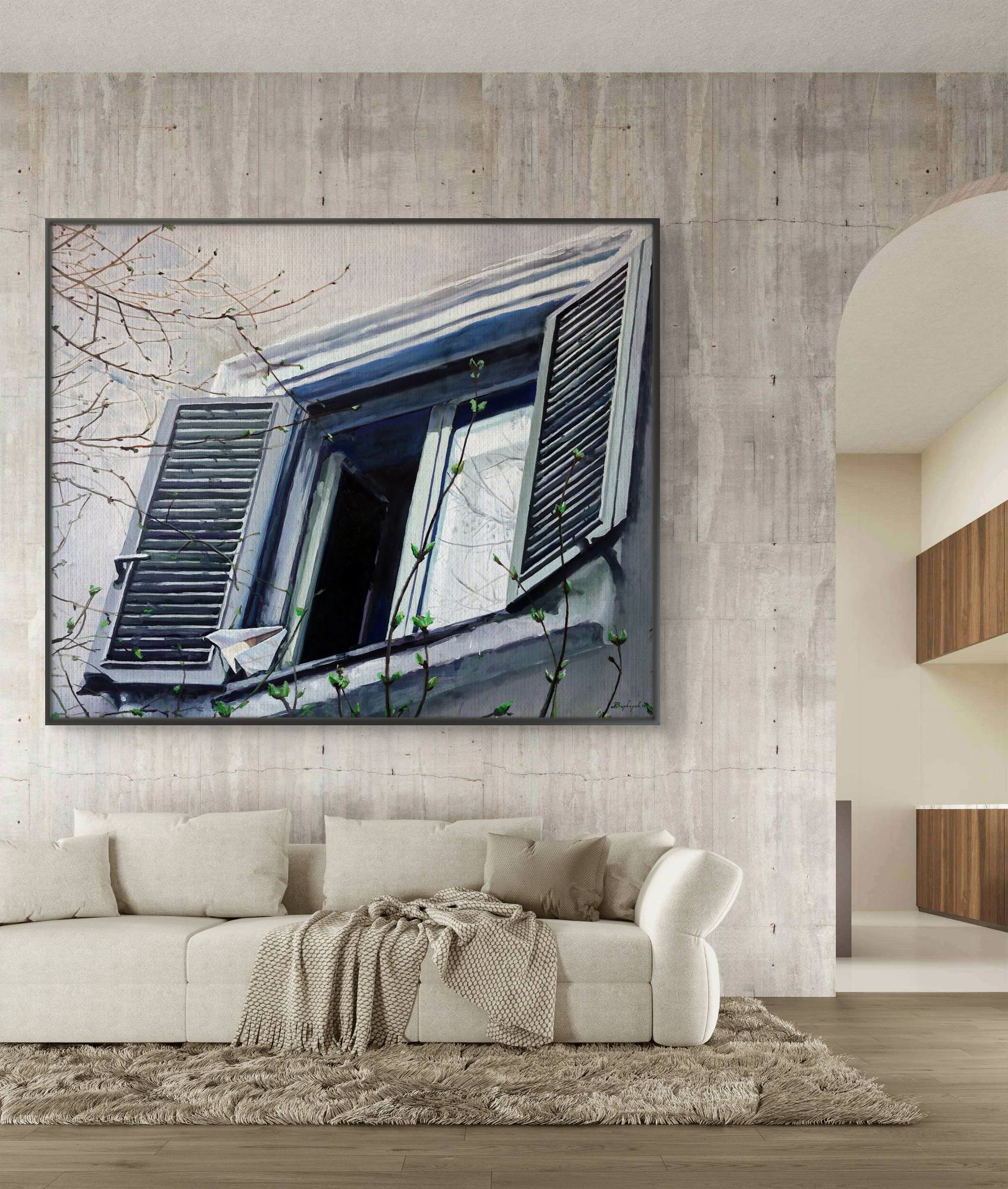 Framed artwork of a window scene on a wall above a sofa in a living room.